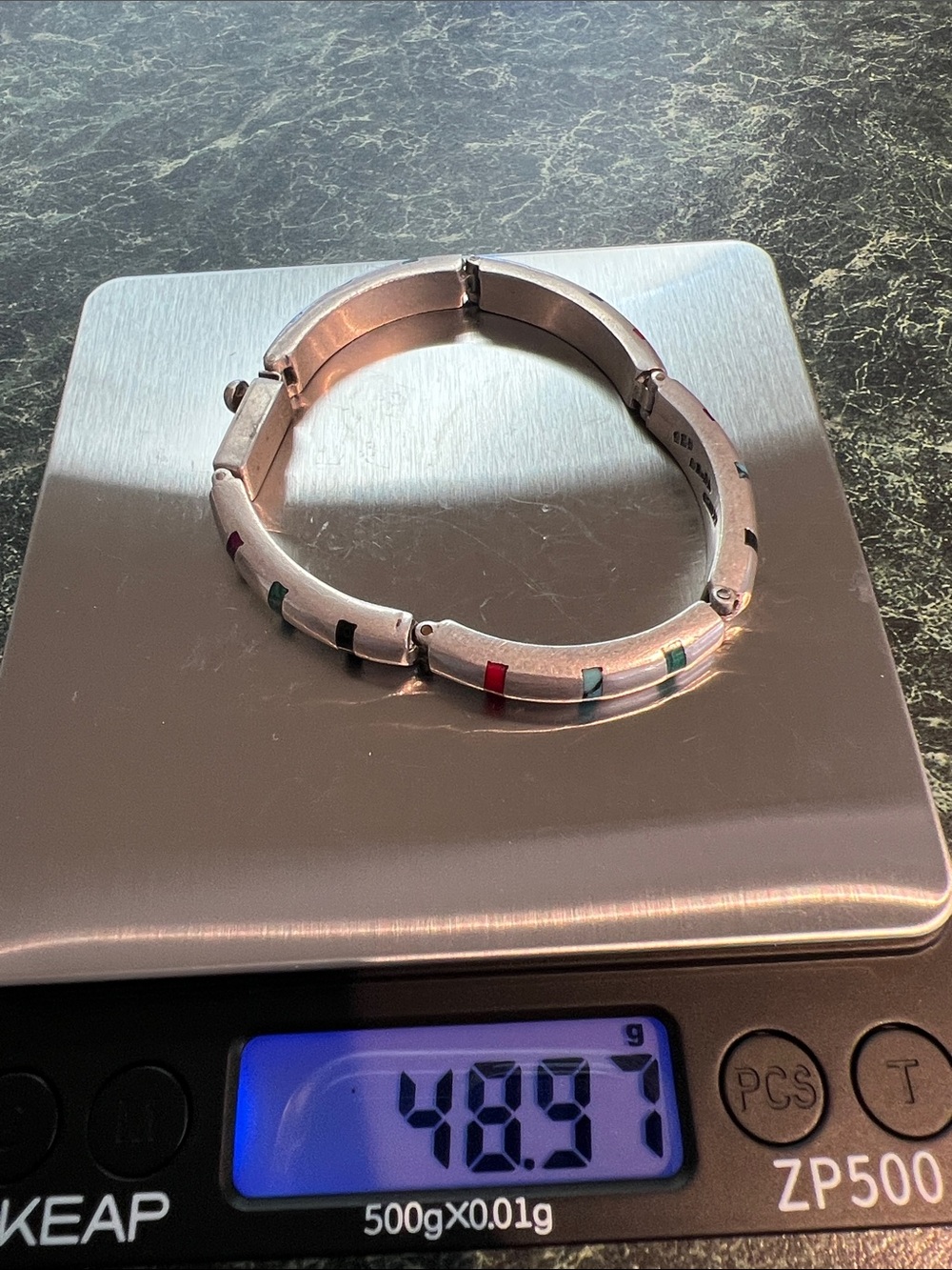Source Unknown Silver-Tone Hinged Bracelet with Red, Green, and Black Accents
